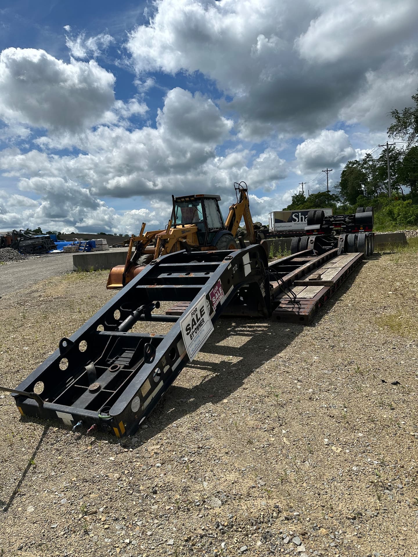 Lowboy trailer staged and ready for an equipment haul